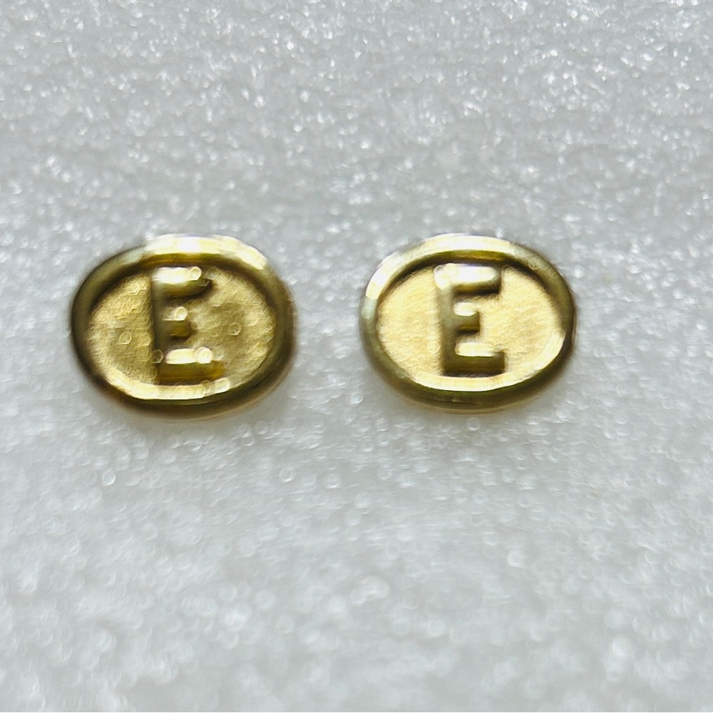 Earrings, E on each.  Excellent condition. No backs. Studs.